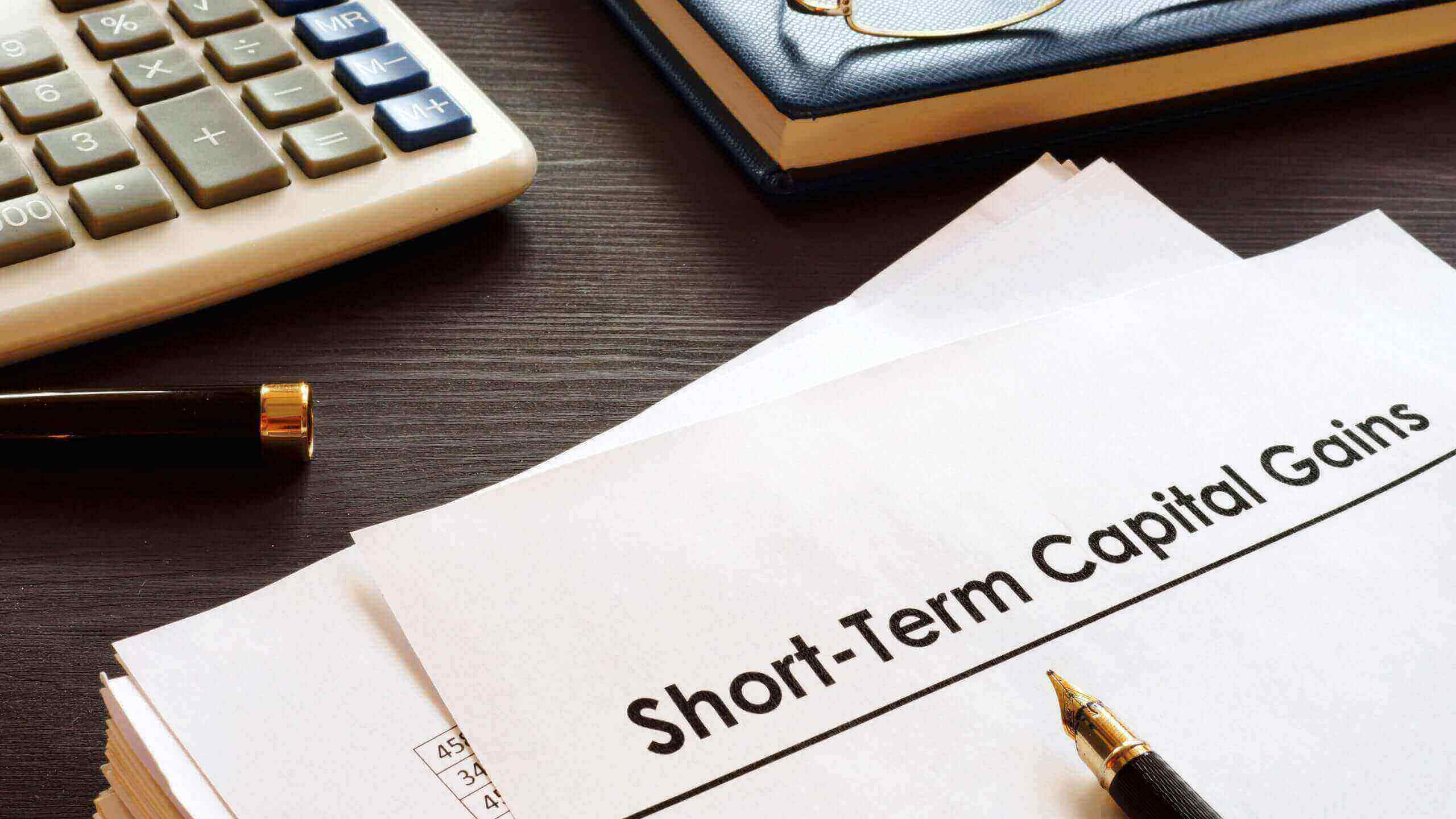 Short Term Capital Gains Tax in India for NRI Real Estate Investment | Assetmonk